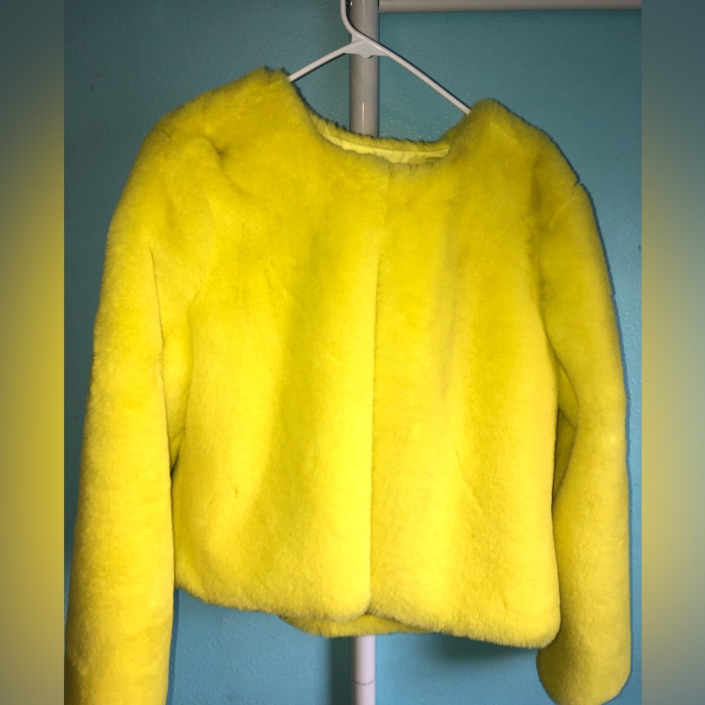 Worn once to a Christmas party. This jacket is eye-catching and very warm.